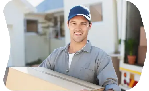 Two removalists moving boxes up stairs